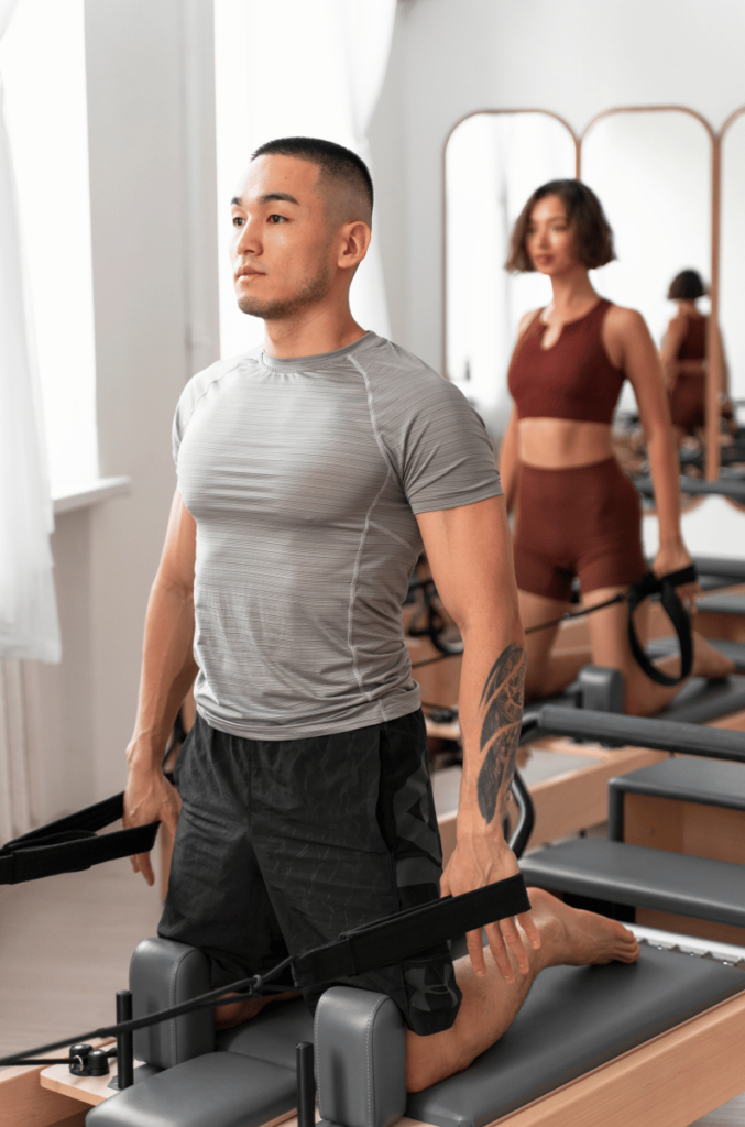 Performe Center Fitness - homme faisant du pilates reformer